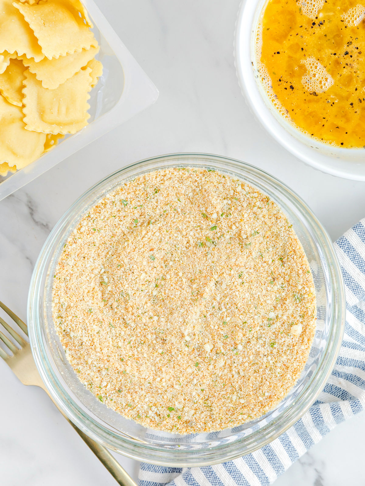 Bowl of seasoned bread crumbs.