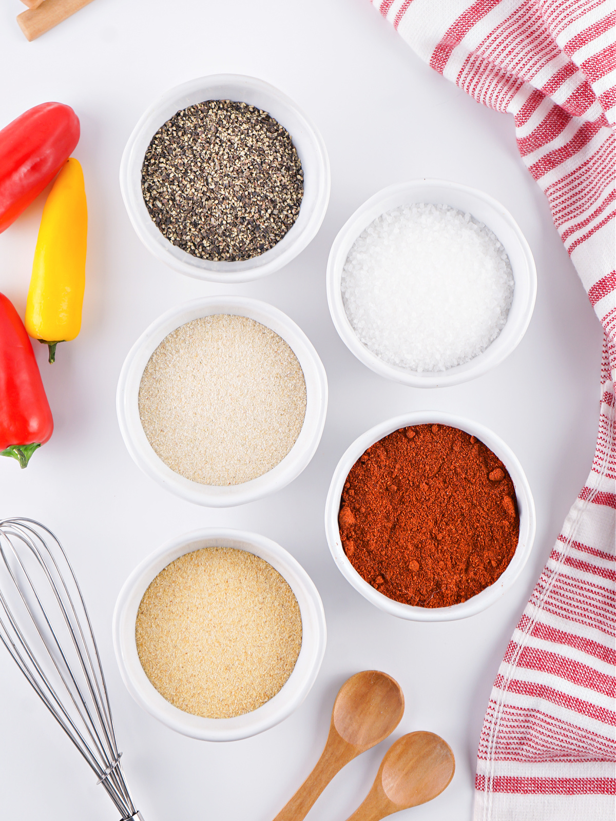 Ingredients to make BBQ rub in small bowls.