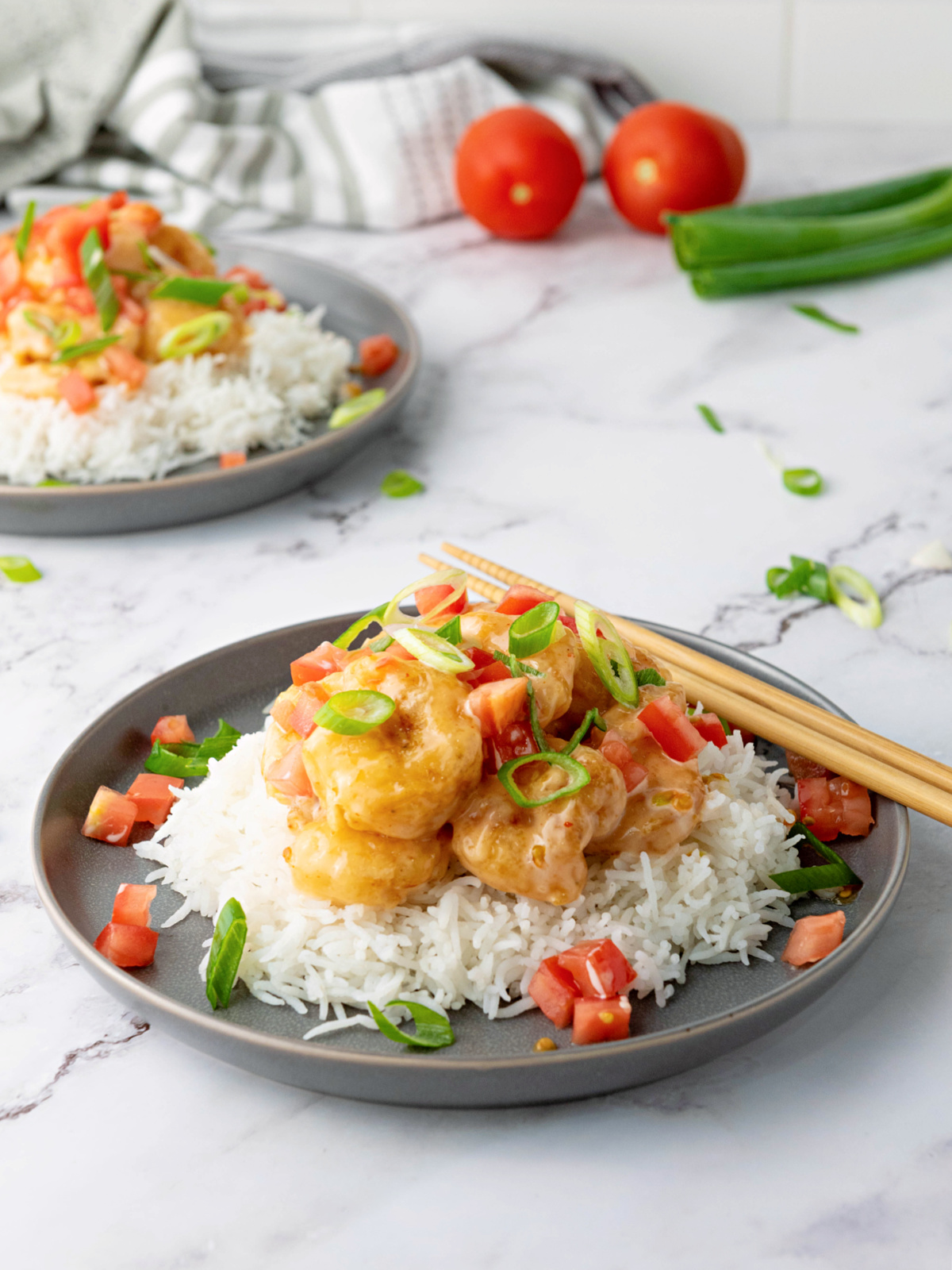 Two plates of bang bang shrimp and rice.