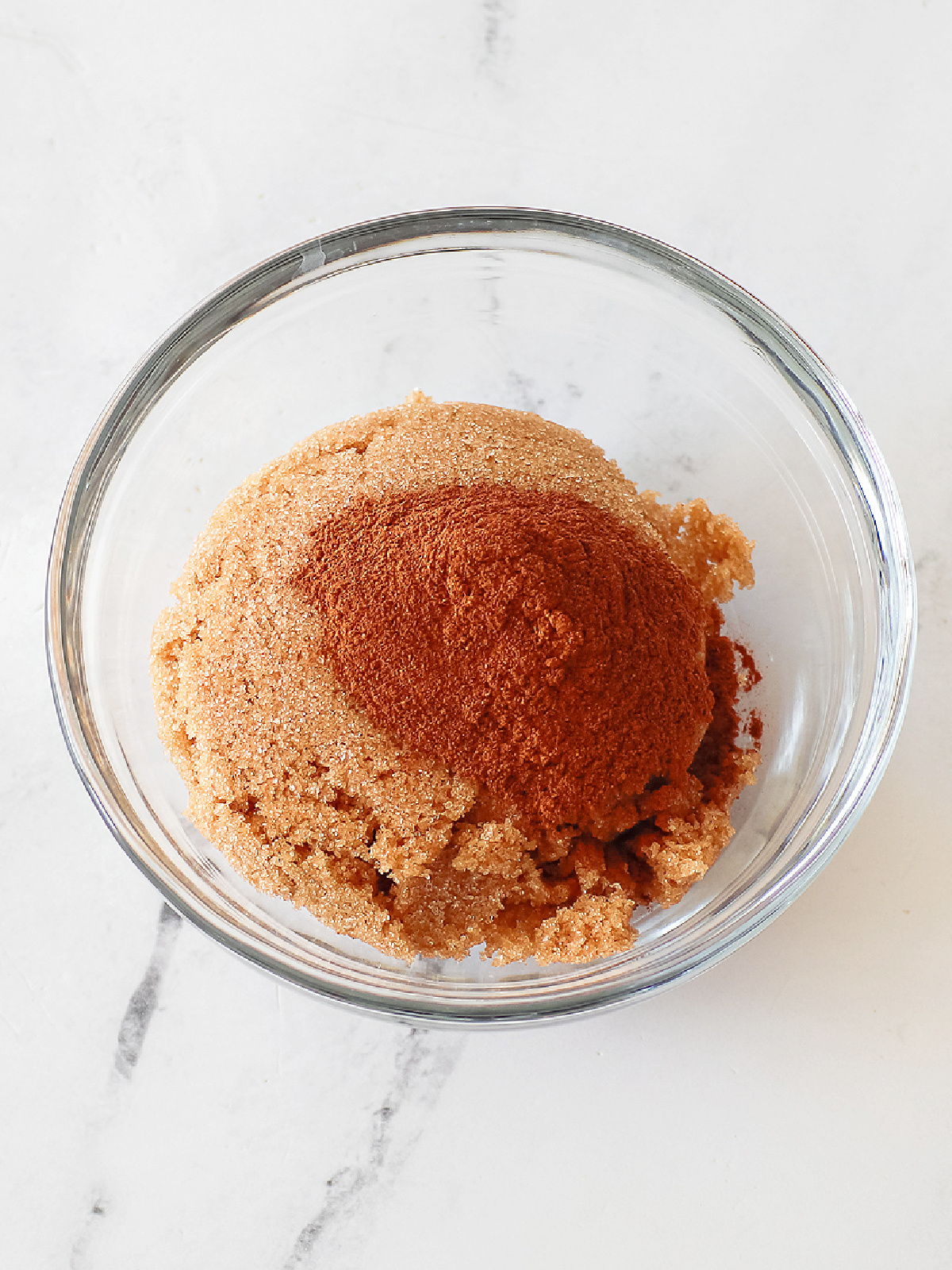 Cinnamon and brown sugar in a small bowl.