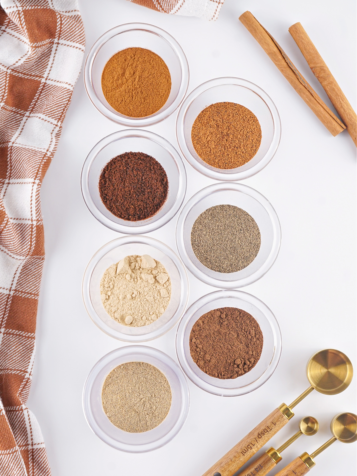 Spices in small bowls used to make Chai Spice Mix.