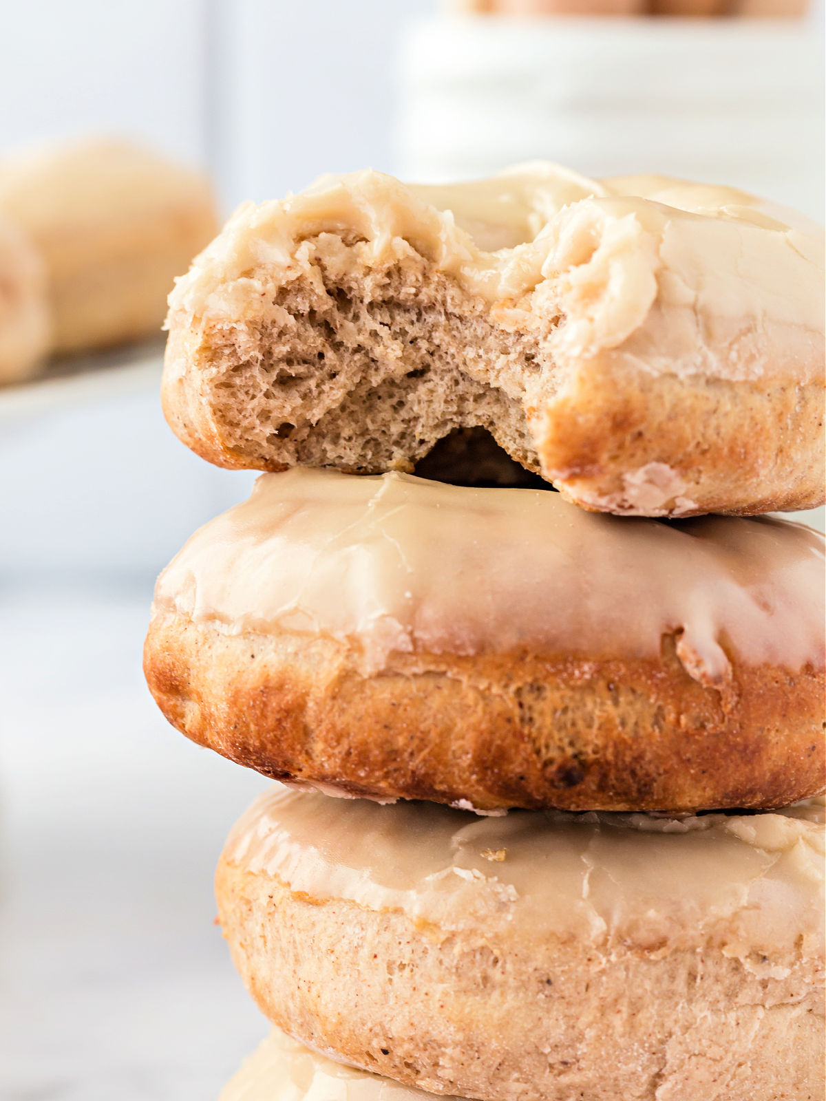 Stack of iced maple doughnuts.