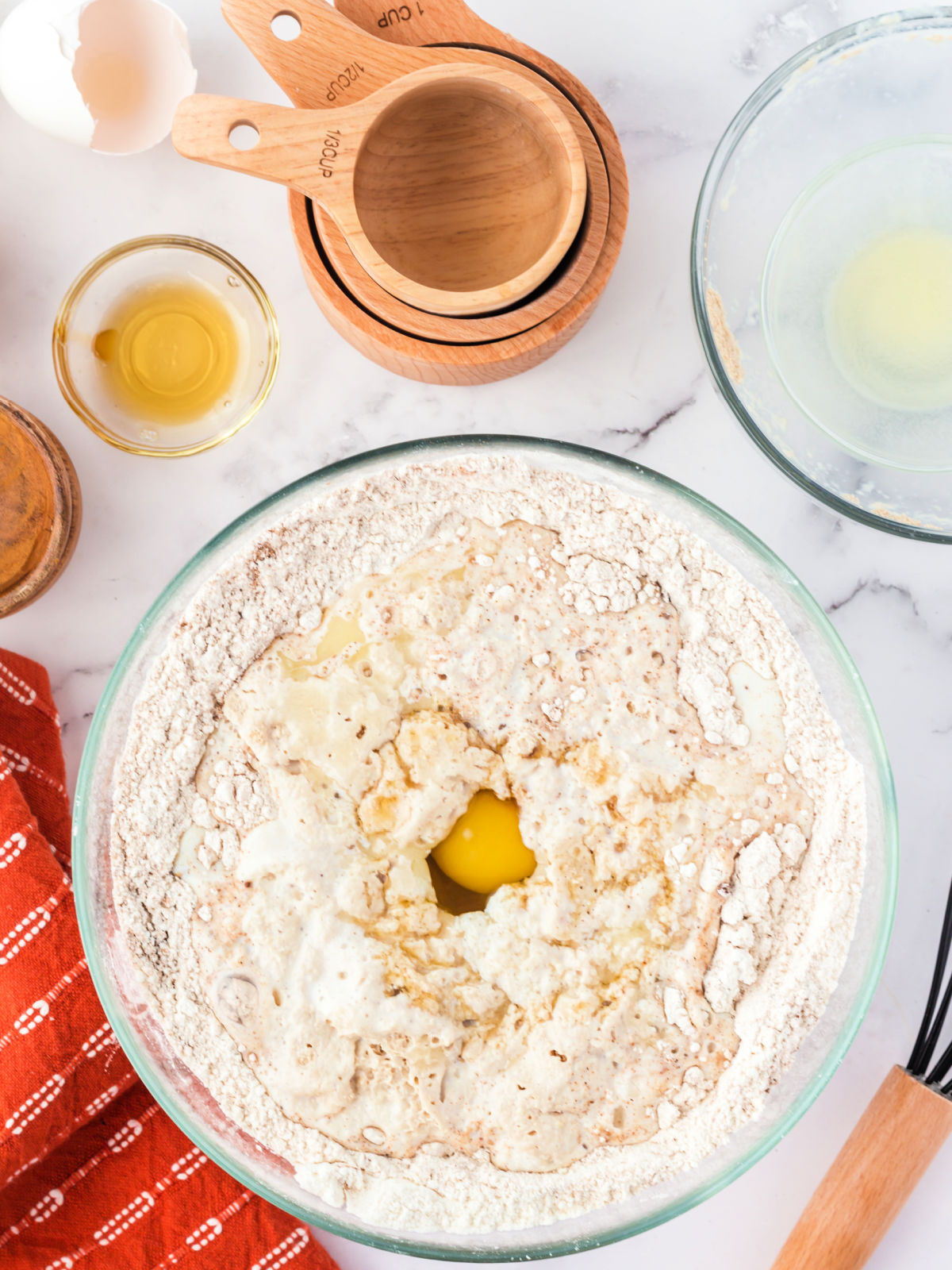 Eggs being mixed into a flour mixture.