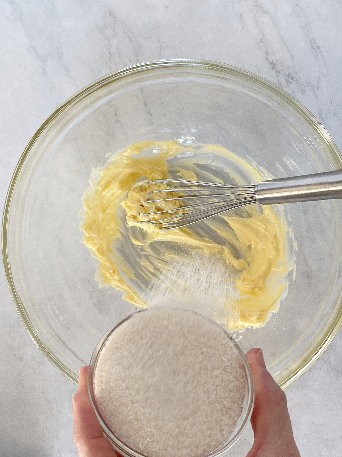 Butter and sugar being whisked together.