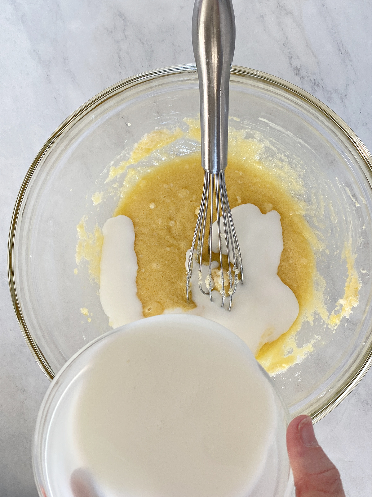 Milk being added to a butter mixture.