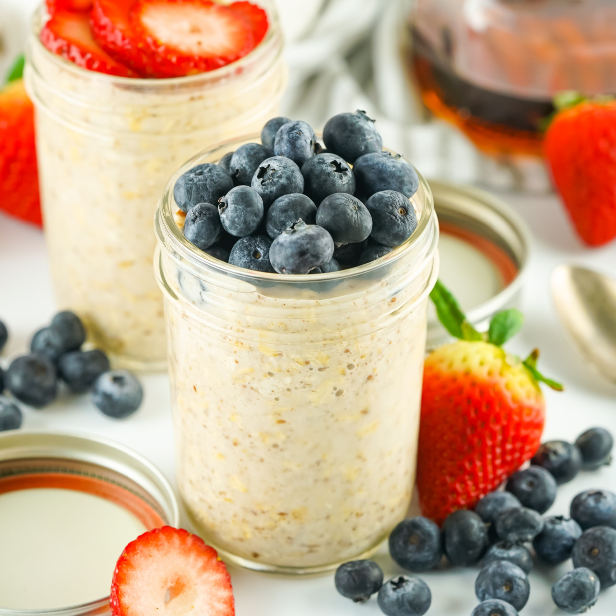 Jar of overnight oats topped with fresh blueberries.