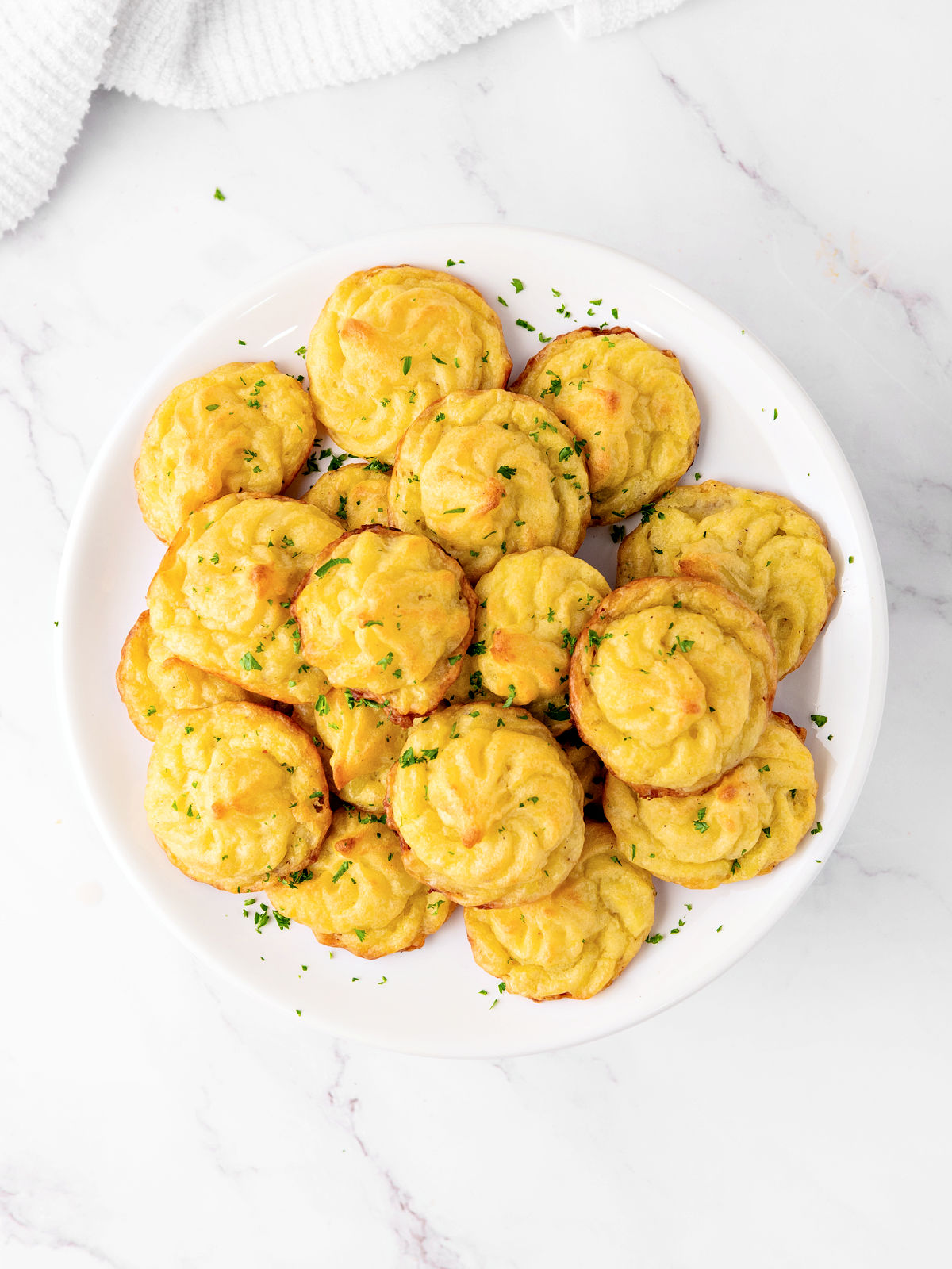 Pommes Duchesse on a plate.