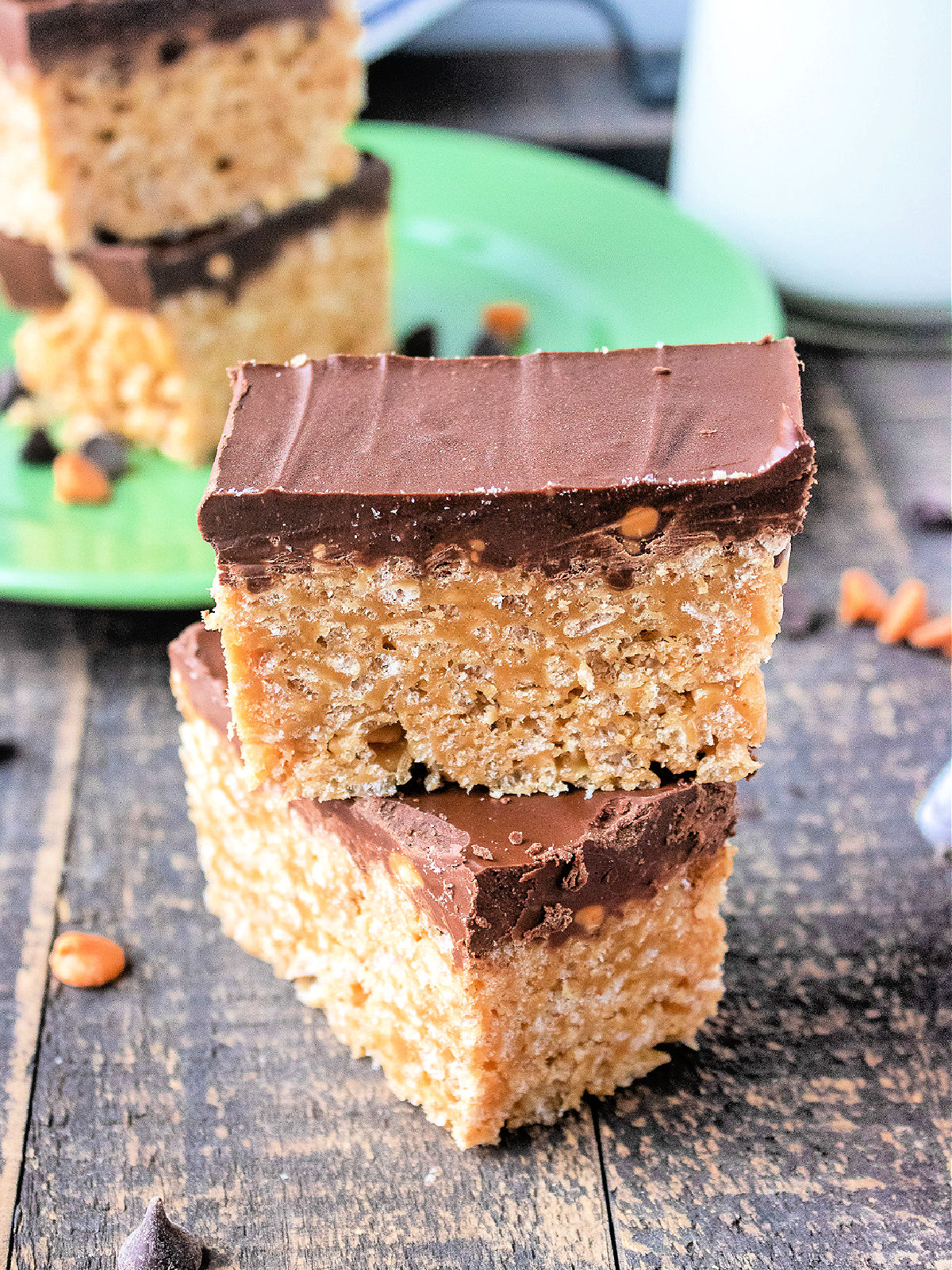 Stack of peanut butter Rice Krispies treats topped with chocolate.