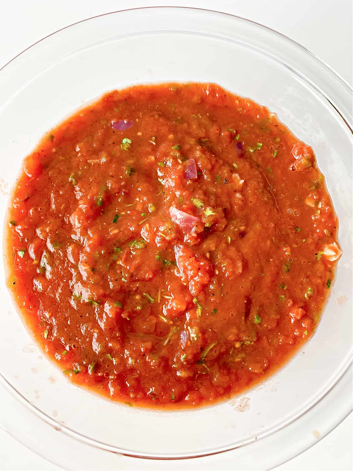 Pureed salsa in a glass bowl.