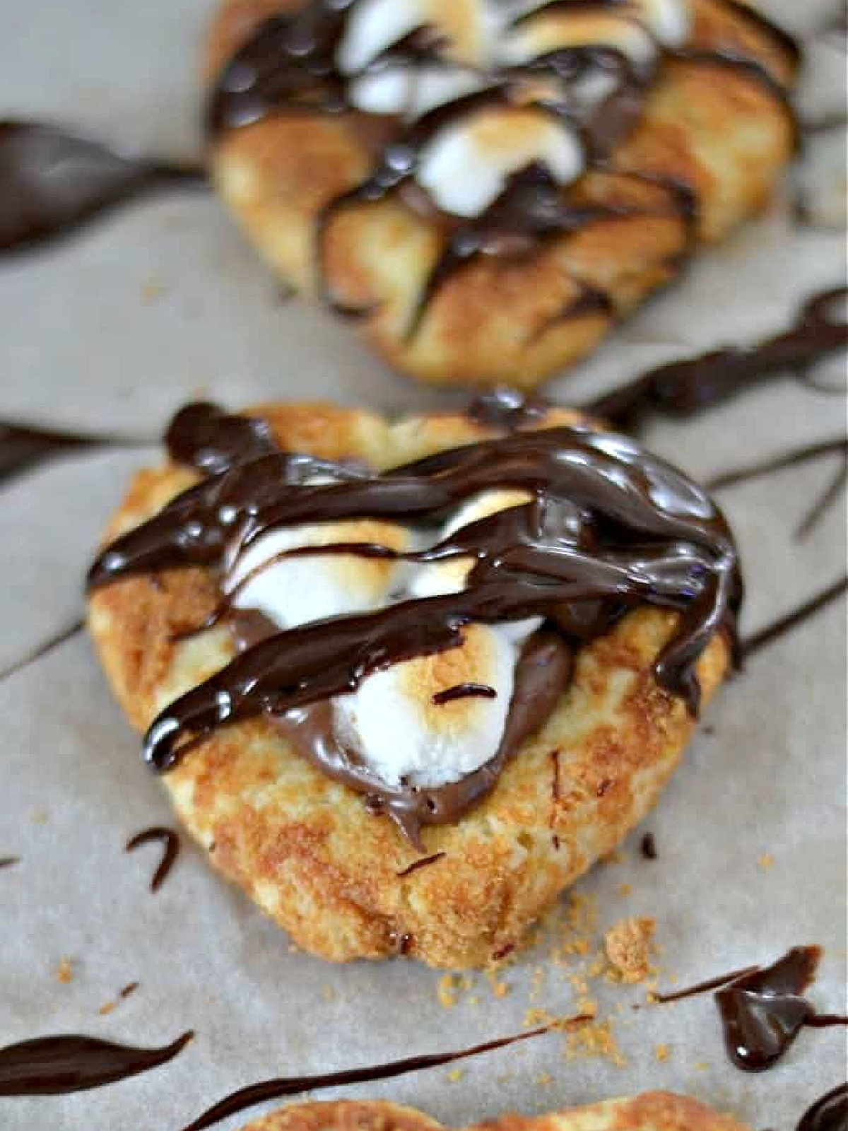 Nutella s'mores cookies on a cookie sheet.