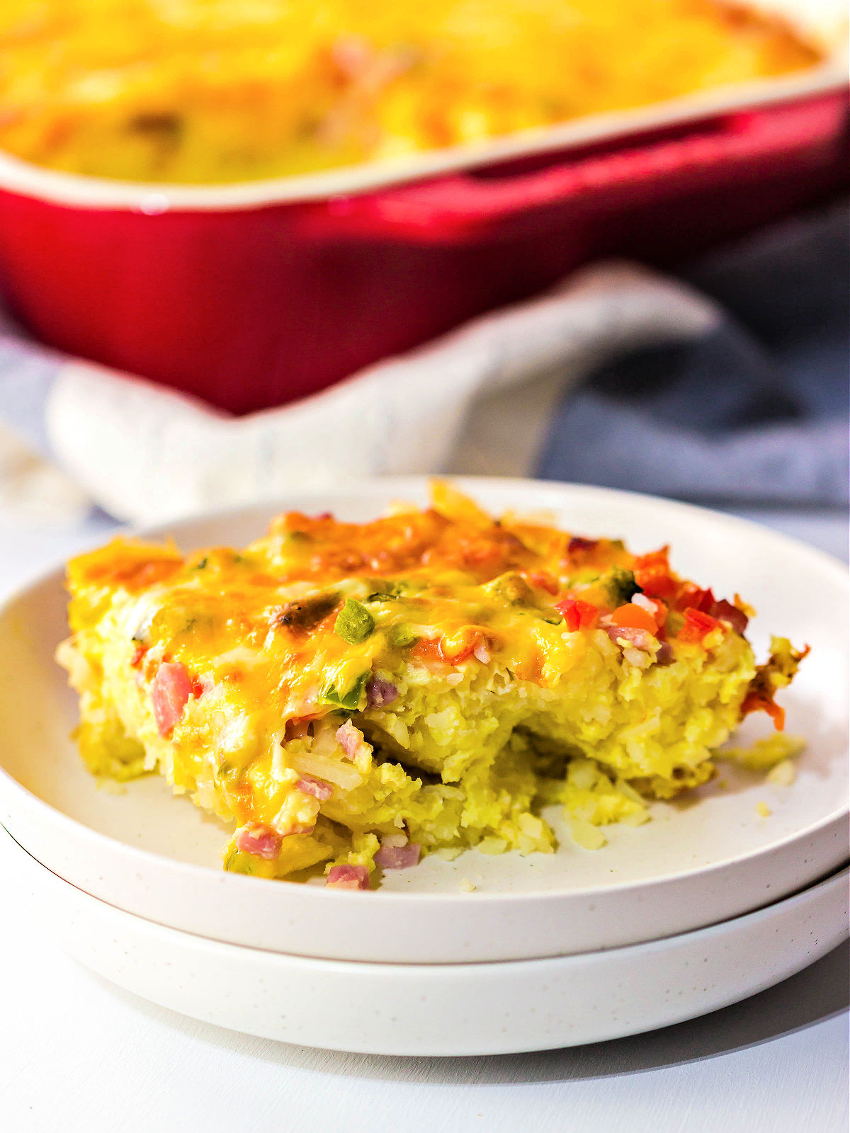 A serving of breakfast casserole on a plate.