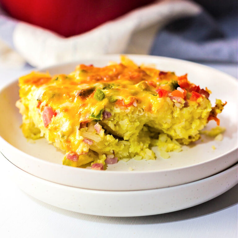 Cheesy breakfast casserole on a plate.