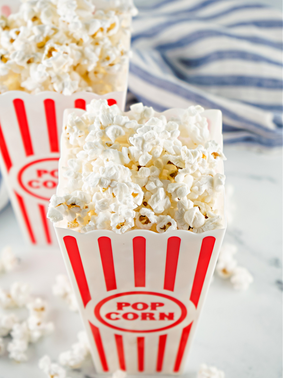 Popcorn in a red and white container.